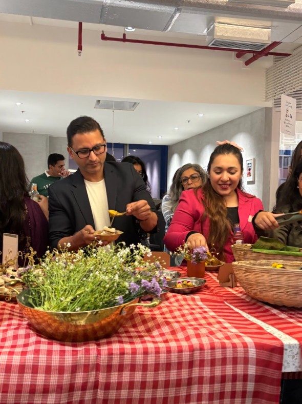Guests enjoying the modern Bengali spread